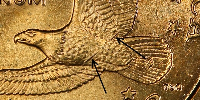 2000-P Wounded Eagle Sacagawea dollar showing die crack across eagle breast reverse